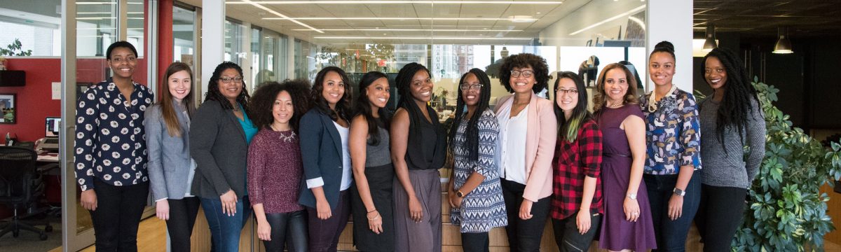 Group of women involved in Workplace Campaign for United Way of York County, SC posing together and smiling in an office.